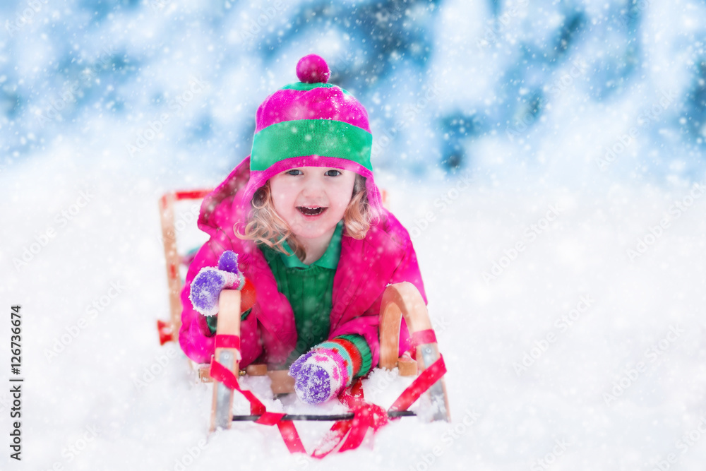Little girl playing in snowy winter forest Little girl playing in snowy winter forest