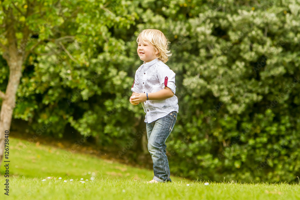 outdoor portrait of young happy smiling boy in park outdoor portrait of young happy smiling boy in park