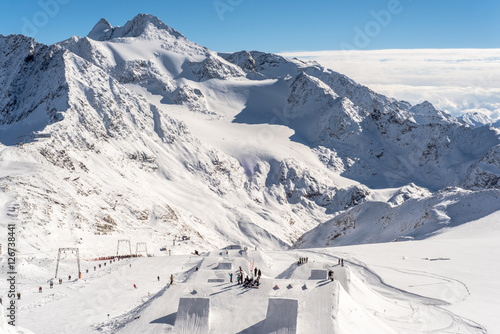 Skiing and Snowboarding in the winterly Stubai Alps photo