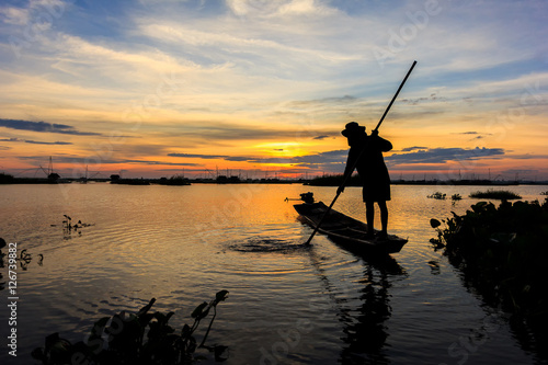 fishermen in lake on morning sunrise © PThira89