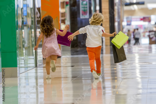 Kids shopping. cute little girl and boy on shopping. portrait of