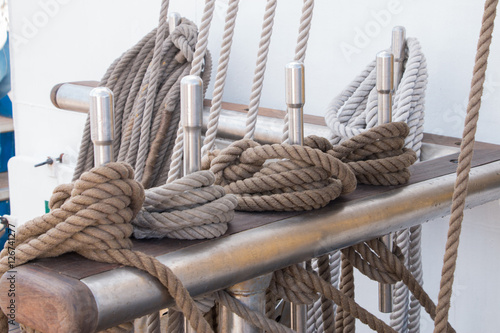Detail of Deck, pulley block and ropes, rigging on a tall ship, sail yacht. Close up view sail yacht