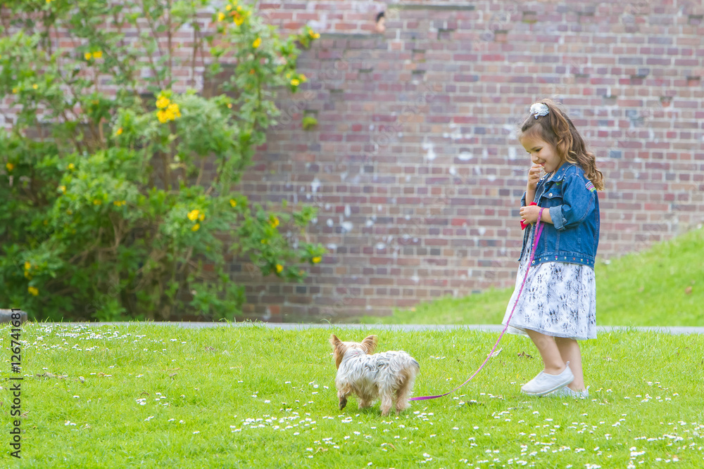 outdoor portrait of young happy smiling child girl playing with outdoor portrait of young happy smiling child girl playing with