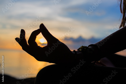 serenity and yoga practicing at sunset, meditation.Twilight in Thailand © Glebstock