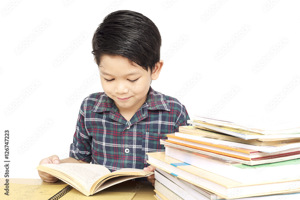 Asian kid is happily preparing for reading a book, isolated over white Asian kid is happily preparing for reading a book, isolated over white