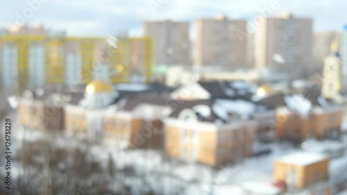 Grebnevskaya church, Odintsovo, Moscow region, Russia. Winter sunny snowy day. Blurred background, falling snow in focus. photo