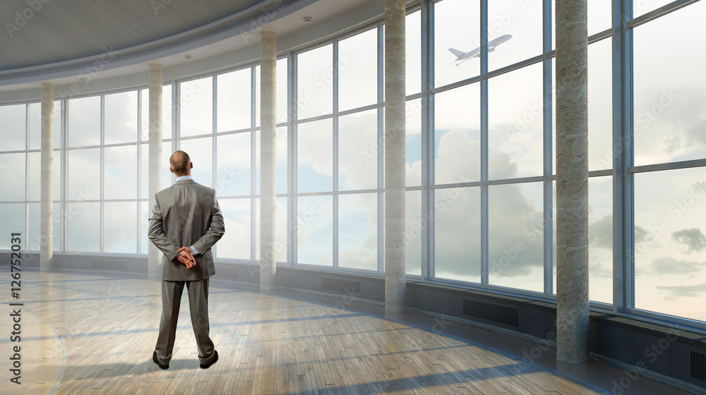 Pensive businessman in office . Mixed media Pensive businessman in office . Mixed media