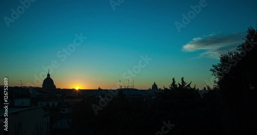 Rome, Italy - St Peters Basilica at sunset - view from the street of St. Sebastianello - Timelapse without motion  photo