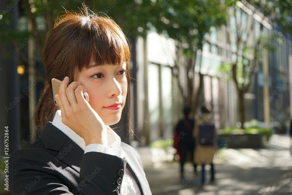 Young woman using a smart phone on the street Young woman using a smart phone on the street