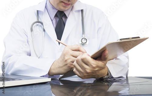 Male doctor is note down a document over white background