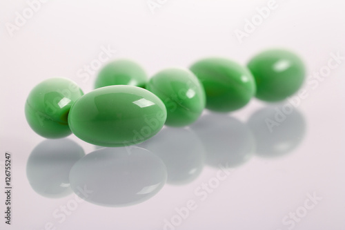 Set of capsules on white background