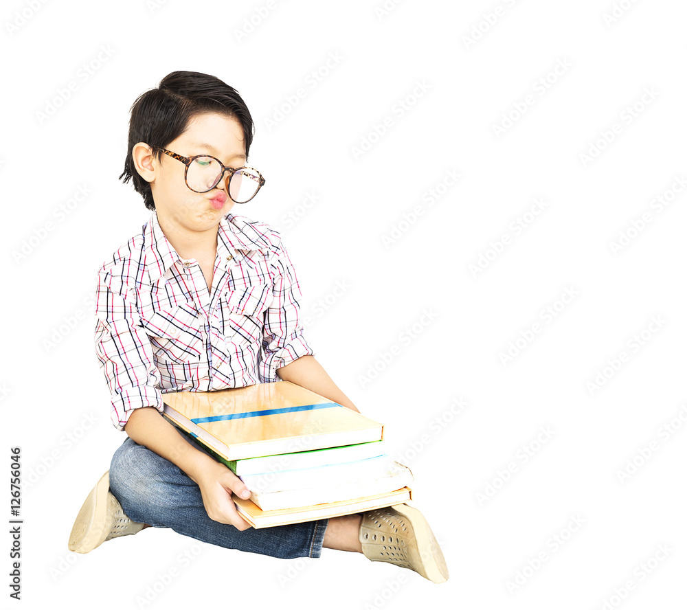 7 years old Asian boy is feeling Bored with a pile of book isola 7 years old Asian boy is feeling Bored with a pile of book isola