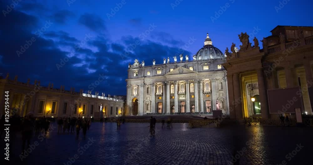 Rome, Italy - Vatican City - St Peter's Square / Piazza San Pietro with view of illuminated St Peters Basilica at night with dramatic cloudy sky - Timelapse with motion Rome, Italy - Vatican City - St Peter's Square / Piazza San Pietro with view of illuminated St Peters Basilica at night with dramatic cloudy sky - Timelapse with motion