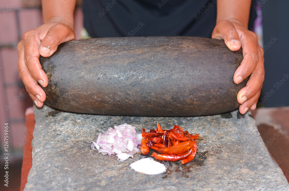 Traditional Sri Lankan way of grinding spices with the grinding stone
