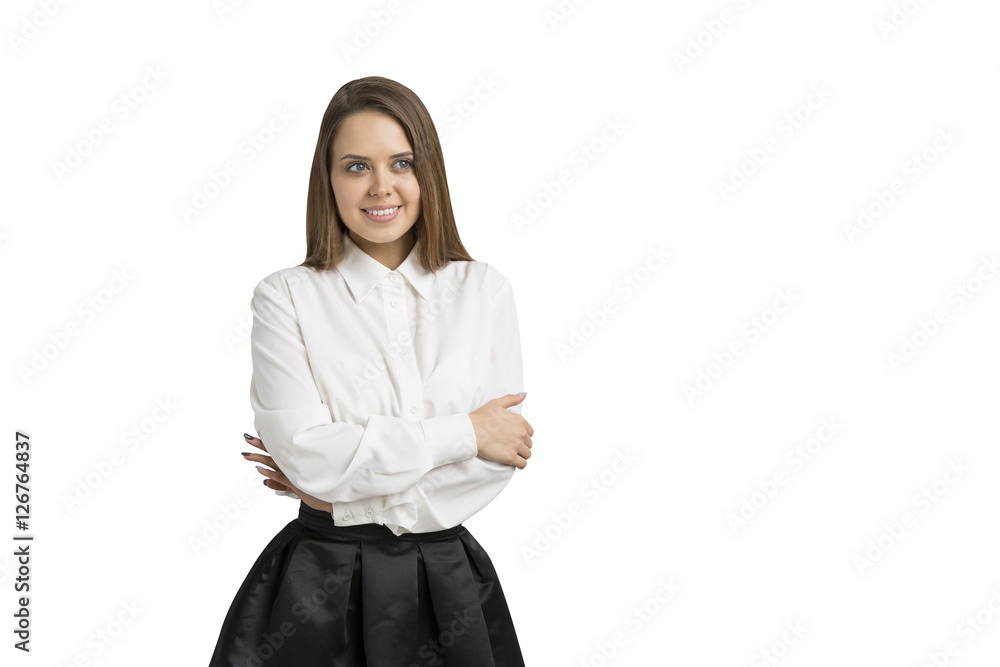 Smiling brown haired woman standing with her arms crossed Smiling brown haired woman standing with her arms crossed