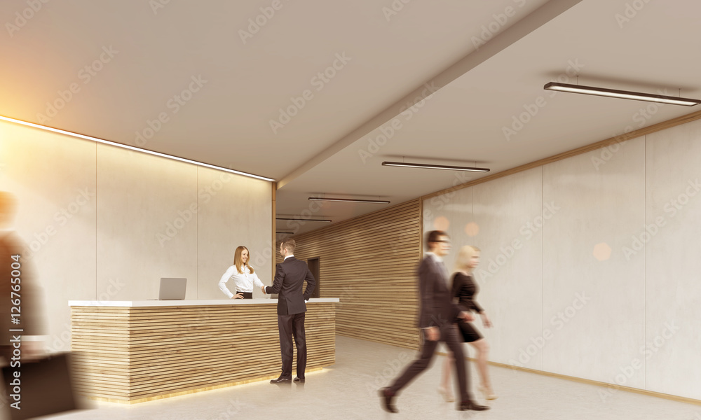 Man talking to blond receptionist. Pair going away