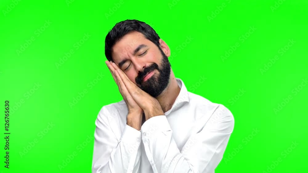 Handsome man making sleep gesture on green screen chroma key Handsome man making sleep gesture on green screen chroma key