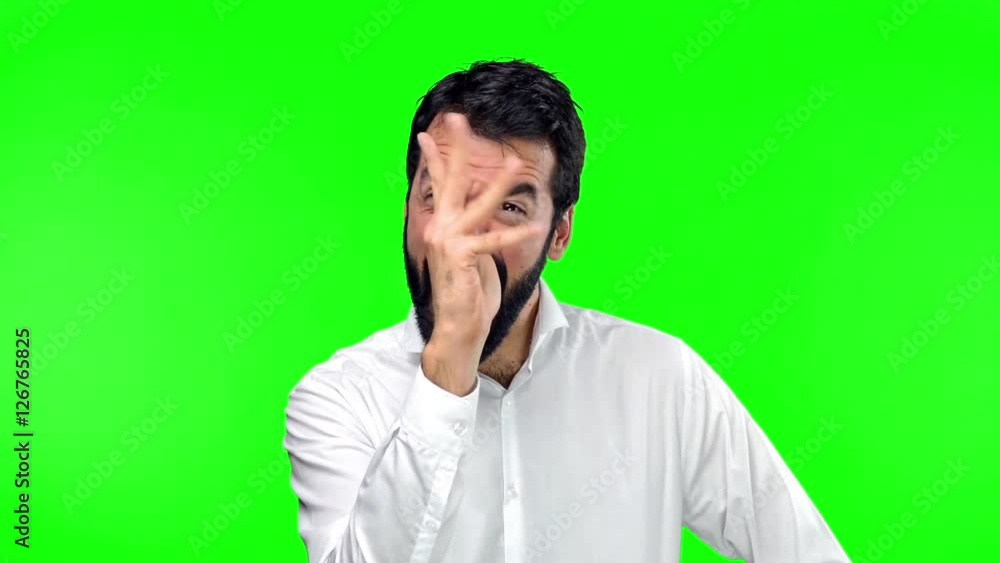 Handsome man making a joke on green screen chroma key Handsome man making a joke on green screen chroma key