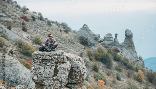 Man on stone of Demerdji mountain photo