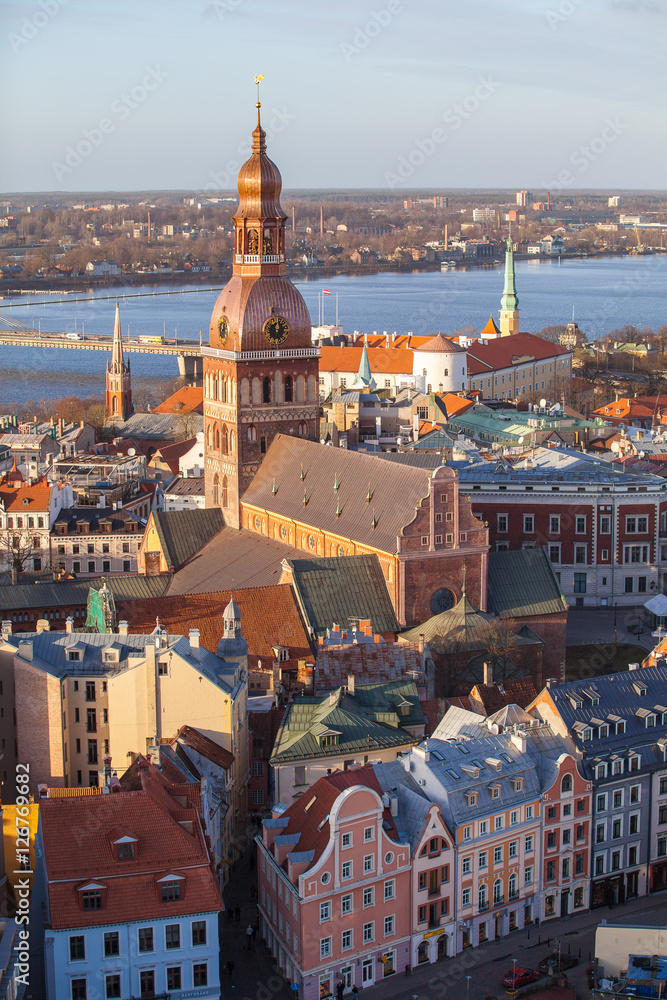 Fototapeta premium Riga Cathedral, Daugava river beautuful old town buildings, aerial summer day view of old town from St Peter church, Latvia. Vertical shot