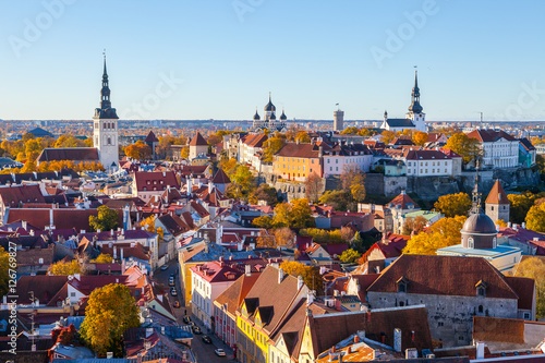 Niguliste church, Nevski Cathedral, Pikk Herman tower and Dome church. Towers and red roofs of old Tallinn, Estonia. Aerial view, autumn season photo