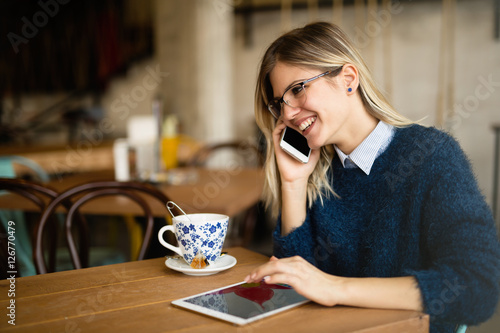 Busy businesswoman drinking coffee