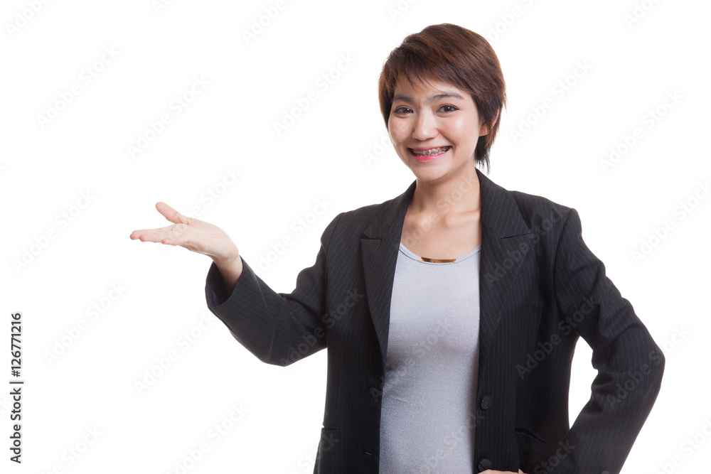 Young Asian business woman present with her hand. Young Asian business woman present with her hand.