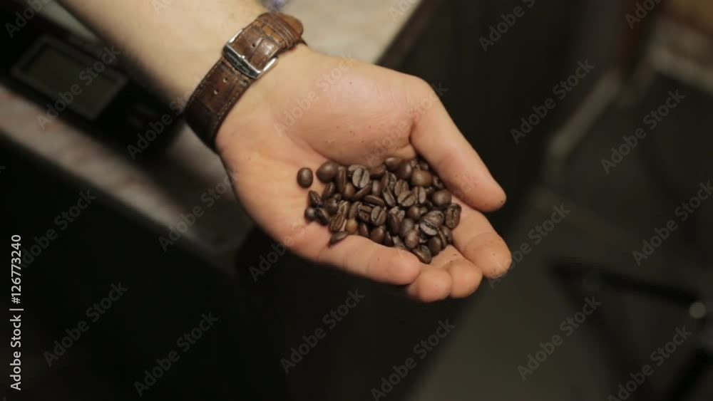 Person makes coffee with coffee machine. Beans coffee in hand. Person makes coffee with coffee machine. Beans coffee in hand.