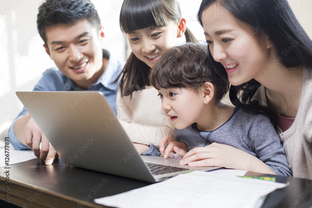 Young family using laptop Young family using laptop