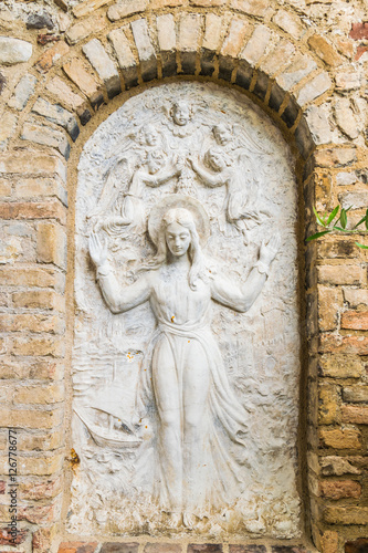 Bas relief representing the Virgin Mary surrounded by angels.