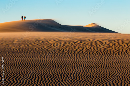 walking on dune de pilat at sunrise