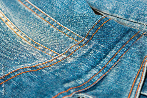 Blue jean or denim on wooden desk,make pattern background,make from cotton,bag of jean