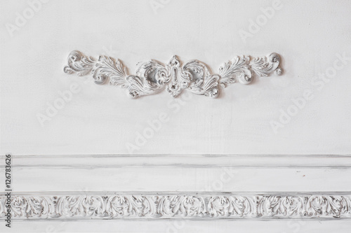 Luxury white wall design bas-relief with stucco mouldings roccoco element. Elements of torsel ornament for use as a texture or background