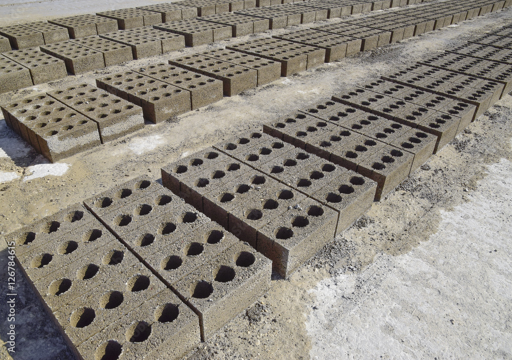 Cinder blocks lie on the ground and dried. on cinder block production plant.