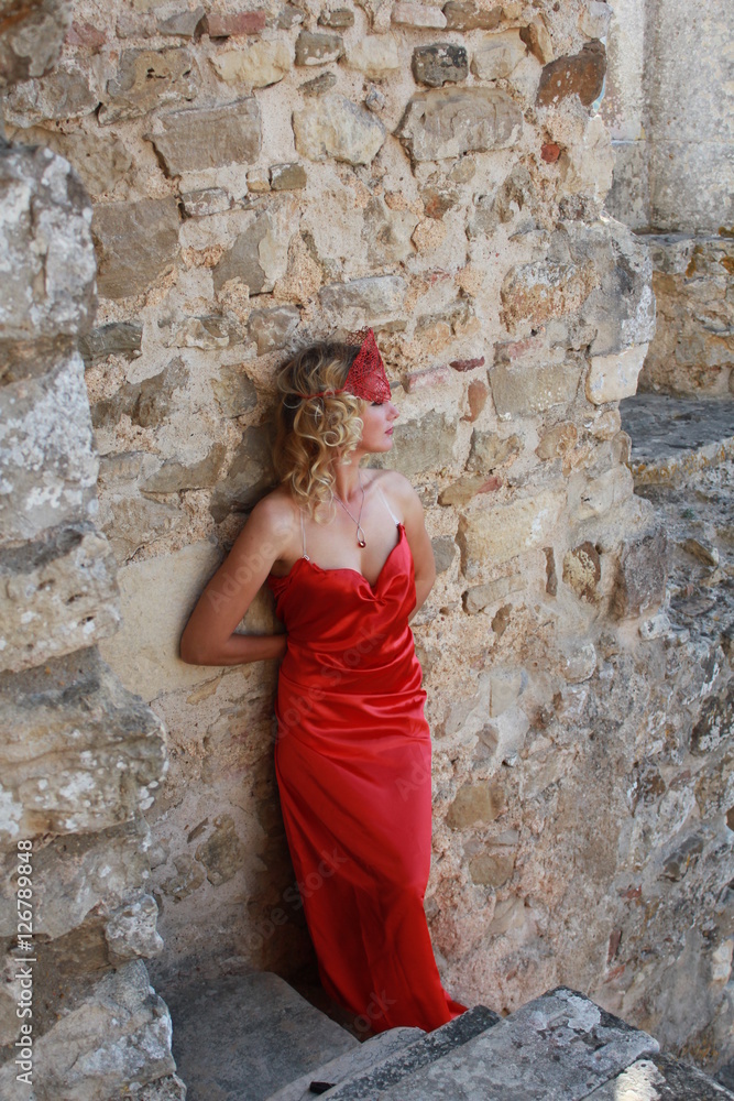 Mysticism. Witchcraft. Sorcerer in Red Mantle. Ancient Castle Mysticism. Witchcraft. Sorcerer in Red Mantle. Ancient Castle
