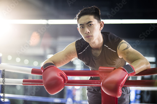 Boxer resting in boxing ring