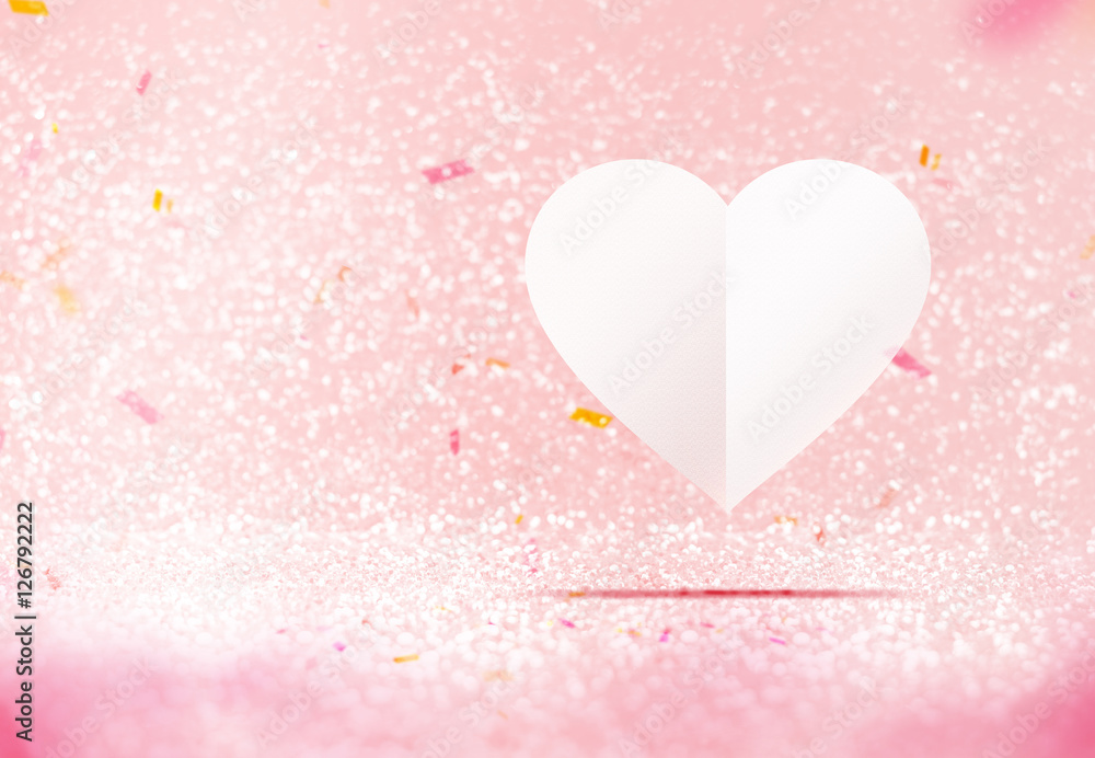 Paper white heart floating at pastel pink sparkling glitter room Paper white heart floating at pastel pink sparkling glitter room