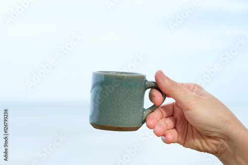 cup in female hand