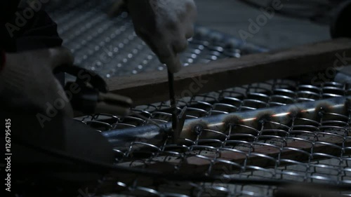 Welder works in the dark 