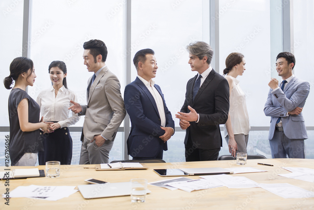 Business people talking in meeting room Business people talking in meeting room