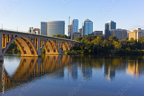 Key Bridge and Rosslyn skyline in early morning, Washington DC, USA. A view n Potomac River from Georgetown Park in US capital. © avmedved