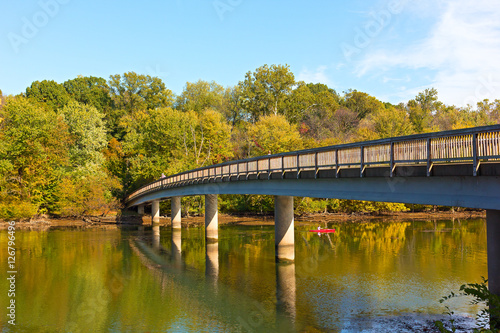 Footbridge bridge to the Theodore Roosevelt Island in Washington DC, USA. Kayaking on Potomac River in early autumn.