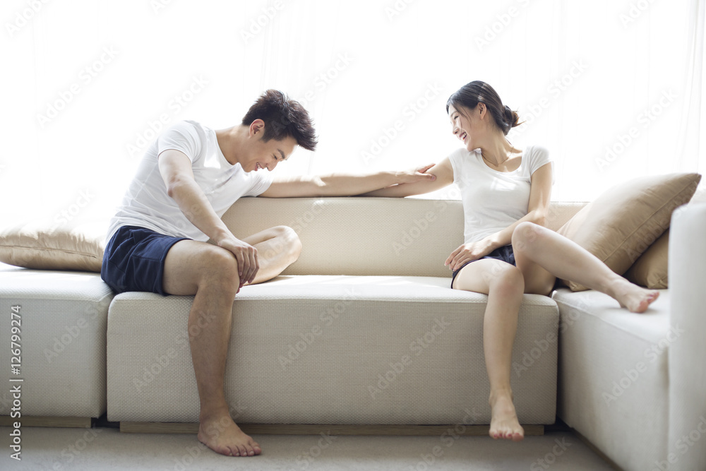 Happy young couple relaxing at home Happy young couple relaxing at home