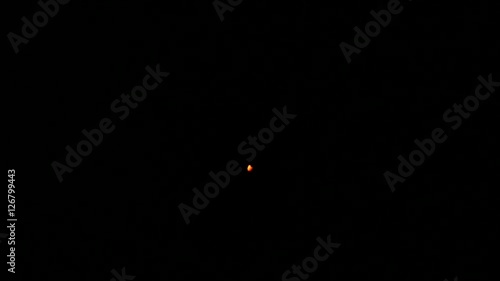 Blown out candle light on black background
