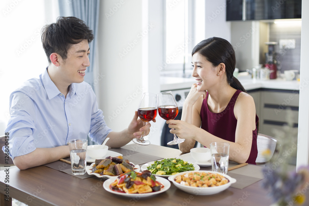 Romantic young couple dining at home