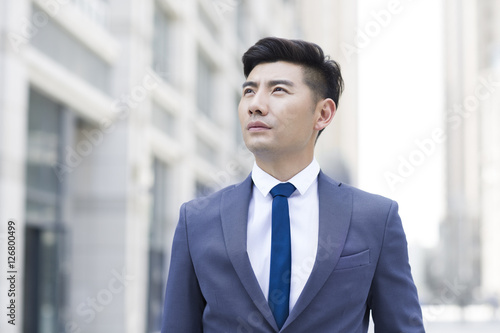 Wallpaper Mural Confident businessman looking at view Torontodigital.ca