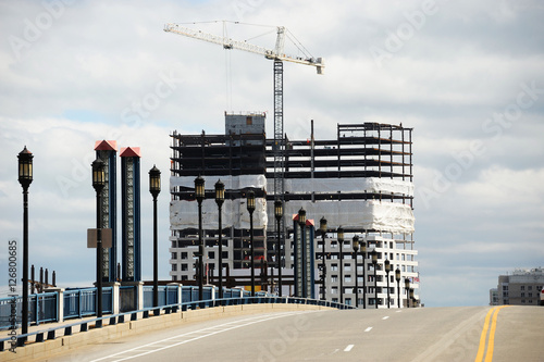 Wallpaper Mural modern skyscraper building construction in Boston behind the bridge and street Torontodigital.ca