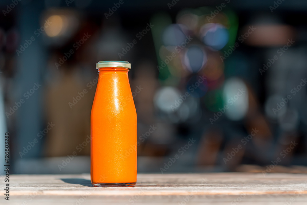 Raw carrot juice in glass bottle Raw carrot juice in glass bottle