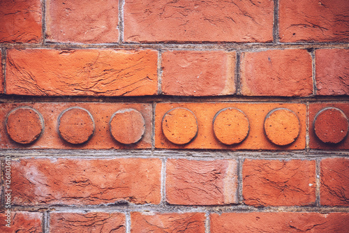 Textured background of bright brick wall