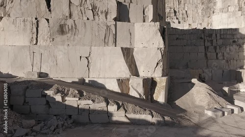 Aerial shot, the worlds famous Carrara marble caves with the soft sunset light, filmed with drone